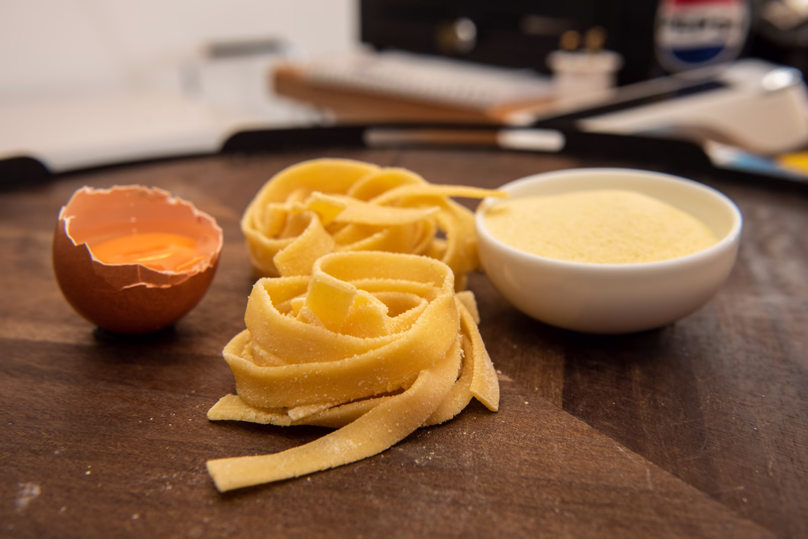 Fresh tagliatelle nests on the workshop table